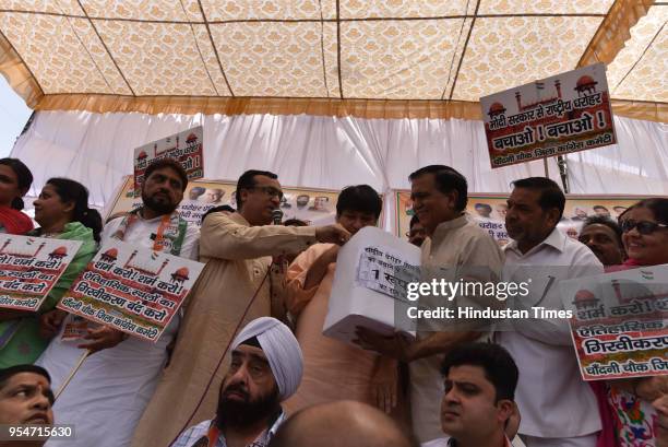 Ajay Maken, President of Delhi Pradesh Congress Committee addresses during a protest organized by Chandni Chowk District Congress against the alleged...