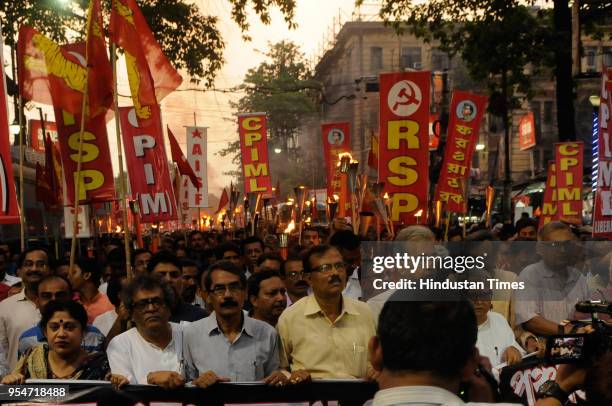 Leaders Biman Bose, Surya Kanta Mishra and other front leaders during a torch rally to protest against violence in West Bengal Panchayat polls from...