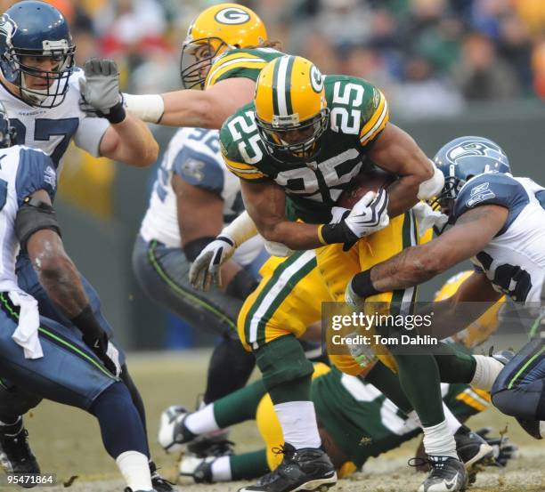 Ryan Grant of the Green Bay Packers carries the ball during an NFL game against the Seattle Seahawks at Lambeau Field, December 27, 2009 in Green...