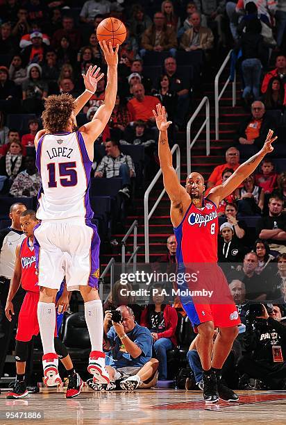 Brian Skinner of the Los Angeles Clippers defends the shot by Robin Lopez of the Phoenix Suns during the game on December 25, 2009 at US Airways...