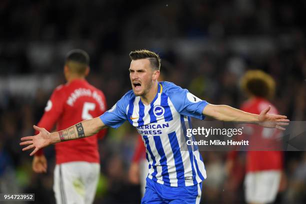 Pascal Gross of Brighton & Hove Albion celebrates scoring the opening goal during the Premier League match between Brighton and Hove Albion and...