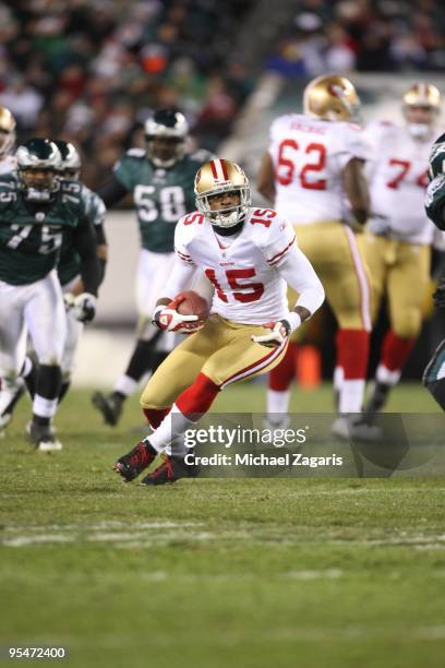 Michael Crabtree of the San Francisco 49ers runs the ball after making a reception during the NFL game against the Philadelphia Eagles at Lincoln...