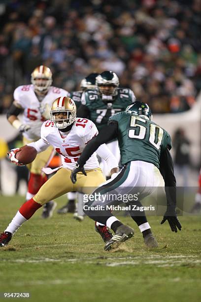 Michael Crabtree of the San Francisco 49ers runs the ball after making a reception during the NFL game against the Philadelphia Eagles at Lincoln...