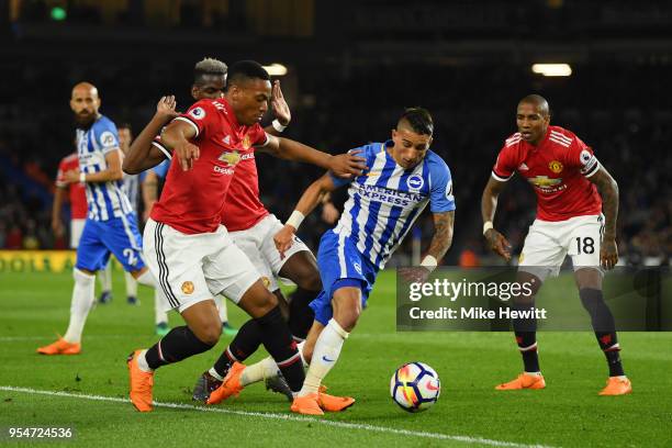 Anthony Knockaert of Brighton & Hove Albion goes down in the box as he is challenged by Anthony Martial of Manchester United during the Premier...