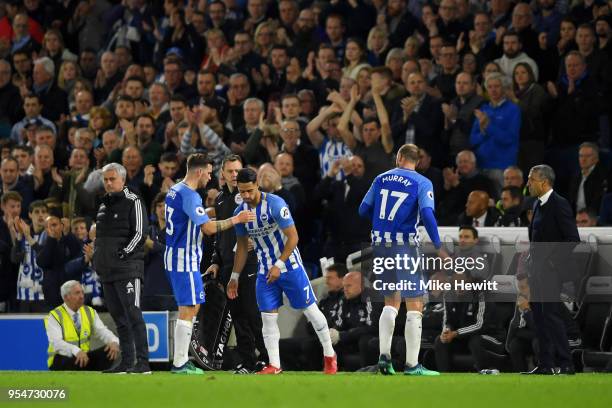 Jose Mourinho, manager of Manchester United and Chris Hughton, manager of Brighton & Hove Albion look on as goalscorer Pascal Gross of Brighton &...