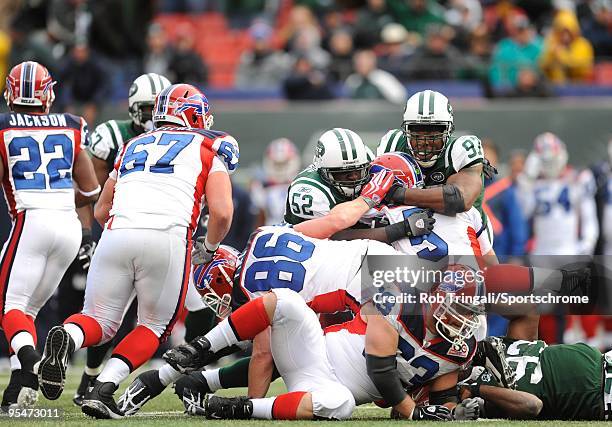 David Harris and Calvin Pace of the New York Jets sack Trent Edwards of the Buffalo Bills at Giants Stadium on October 18, 2009 in East Rutherford,...