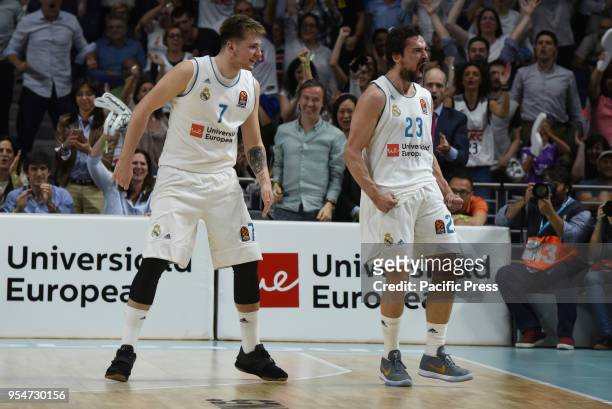 Sergio Llull , #23 of Real Madrid, and Luka Doncic, #7 of Real Madrid celebrate after a three point shot during the 2017/2018 Turkish Airlines...