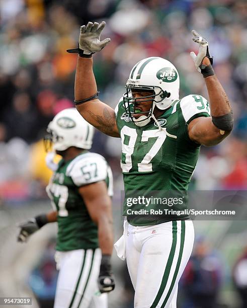 Calvin Pace of the New York Jets gestures to the crowd during the game against the Buffalo Bills at Giants Stadium on October 18, 2009 in East...