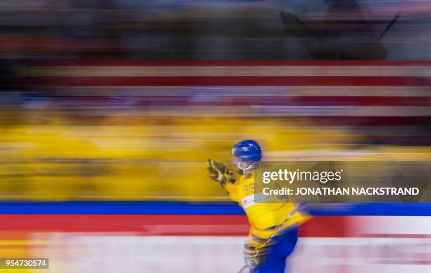 Sweden's Mika Zibanejad celebrates with his teammates after scoring a goal during the 2018 IIHF Men's Ice Hockey World Championship match between...