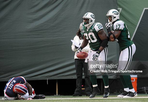 Thomas Jones of the New York Jets in the end zone with teammate Braylon Edwards after scoring a touch down against the Buffalo Bills at Giants...