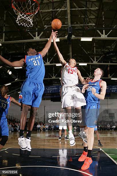 Tony Bobbitt of the Maine Red Claws rebounds against Latavious Williams and Byron Mullens of the Tulsa 66ers during the NBA D-League game on December...