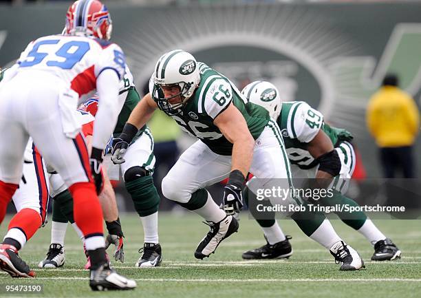 Alan Faneca of the New York Jets blocks against the Buffalo Bills at Giants Stadium on October 18, 2009 in East Rutherford, New Jersey. The Bills...
