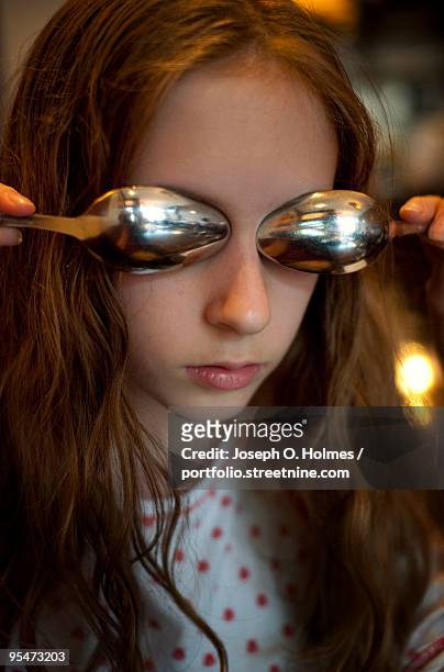 a girl spoon eyes - joseph o. holmes stock pictures, royalty-free photos & images