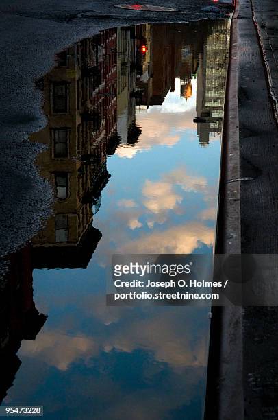 nyc skyline puddle reflection - joseph o. holmes stock pictures, royalty-free photos & images