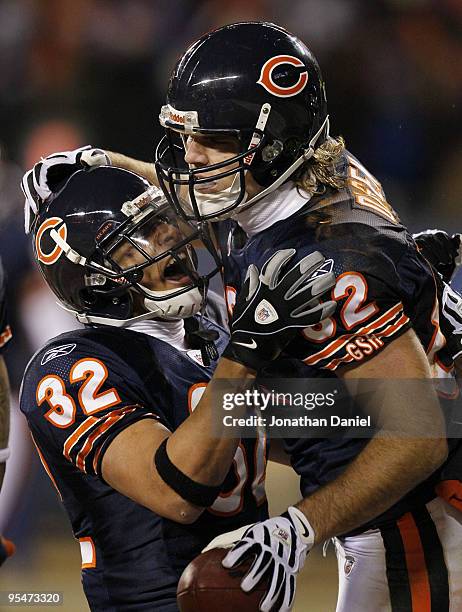 Greg Olsen of the Chicago Bears celebrates his seven-yard touchdown catch with teammate Kahlil Bell against the Minnesota Vikings in the first half...