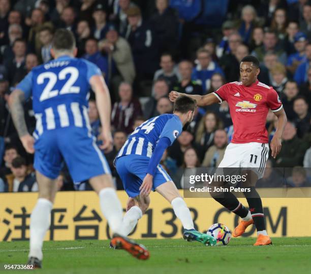 Anthony Martial of Manchester United in action with Davy Propper of Brighton and Hove Albion during the Premier League match between Brighton and...