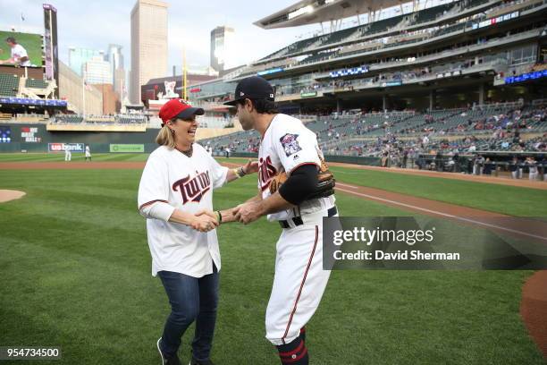 Head Coach Cheryl Reeve of the Minnesota Lynx throws out the first pitch to Ryan LaMarre of the Minnesota Twins at the Minnesota Twins game on May 1,...