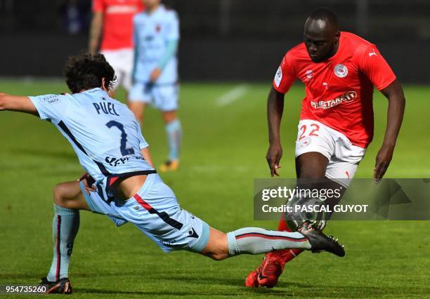 Ajaccio's defender Gregoire Puel vies with Nimes's forward Sada Thioub during the French L2 football match between Nimes and Ajaccio, on May 4, 2018...