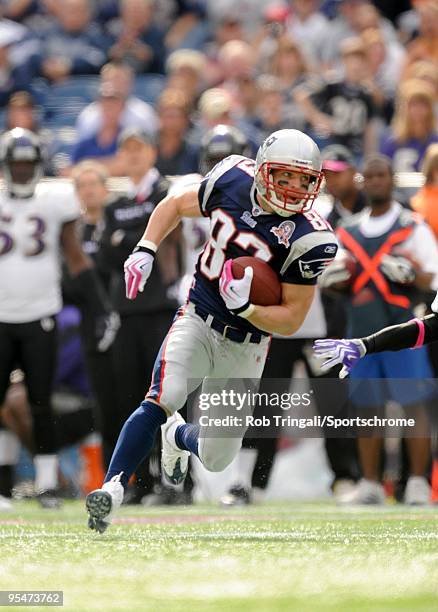 Wes Welker of the New England Patriots runs with the ball against the Baltimore Ravens at Gillette Stadium on October 4, 2009 in Foxboro,...