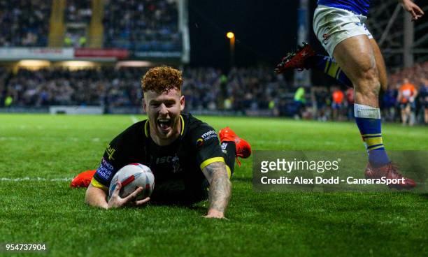 Warrington Wolves' Harvey Livett scores his hat-trick during the Betfred Super League Round 14 match between Leeds Rhinos and Warrington Wolves at...