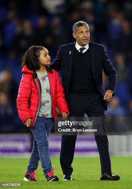 Chris Hughton, manager of Brighton & Hove Albion celebrates on the pitch after the Premier League match between Brighton and Hove Albion and...