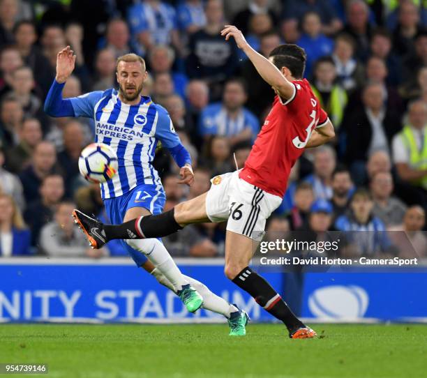 Brighton & Hove Albion's Glenn Murray battles with Manchester United's Matteo Darmian during the Premier League match between Brighton and Hove...