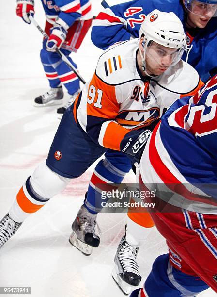 John Tavares of the New York Islanders skates for the puck against the New York Rangers on December 26, 2009 at Madison Square Garden in New York...