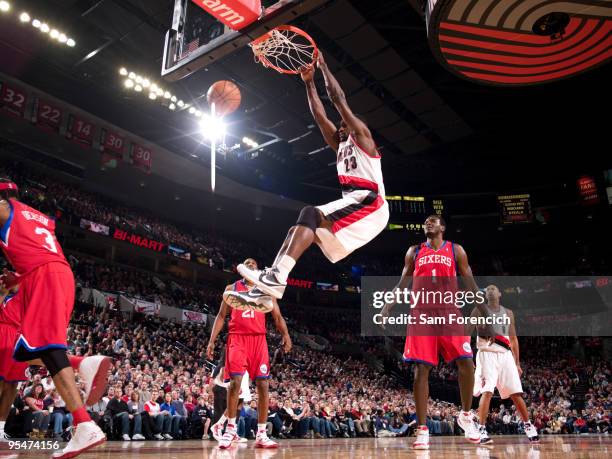 Martell Webster of the Portland Trail Blazers dunks past Samuel Dalembert of the Philadelphia 76ers during a game on December 28, 2009 at the Rose...