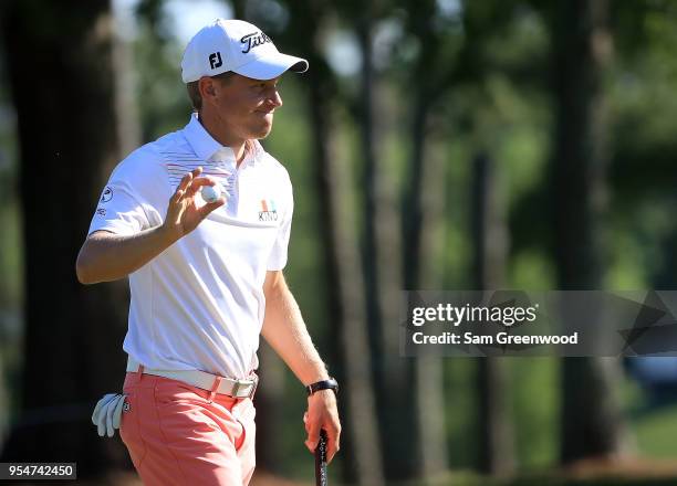 Peter Malnati reacts after his par putt on the ninth green during the second round of the 2018 Wells Fargo Championship at Quail Hollow Club on May...