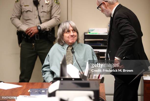 David Allen Turpin, accused of abusing and holding 13 children captive, speaks with his attorney David Macher on May 4, 2018 in Riverside,...