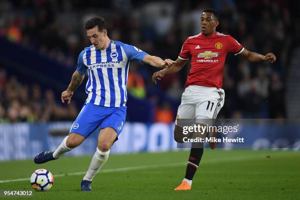 Lewis Dunk of Brighton & Hove Albionis challenged by Anthony Martial of Manchester United during the Premier League match between Brighton and Hove...