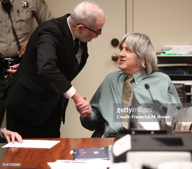 David Allen Turpin, accused of abusing and holding 13 children captive, shakes hands with his attorney David Macher on May 4, 2018 in Riverside,...