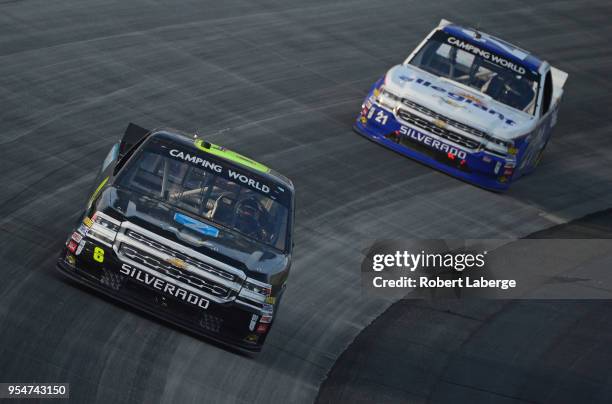 Joe Nemechek, driver of the ACME Grocery Store Chevrolet, leads a pack of trucks during the NASCAR Camping World Truck Series JEGS 200 at Dover...