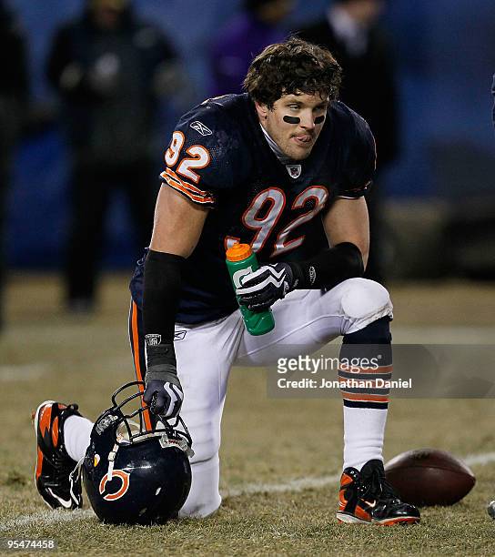 Hunter Hillenmeyer of the Chicago Bears rests during a time-out in the final seconds of regulation of a game against Minnesota Vikings at Soldier...