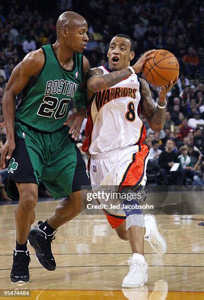 Monta Ellis of the Golden State Warriors drives against Ray Allen of the Boston Celtics during an NBA game at Oracle Arena on December 28, 2009 in...