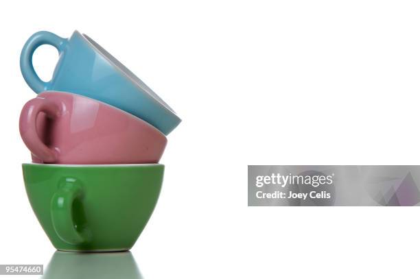 three teacups stacked and tilted - tea cup stock pictures, royalty-free photos & images
