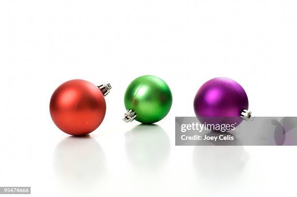 three round holiday ornaments - christmas bulbs stock pictures, royalty-free photos & images