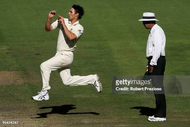 Mitchell Johnson of Australia bowls during day four of the First Test match between Australia and Pakistan at Melbourne Cricket Ground on December...