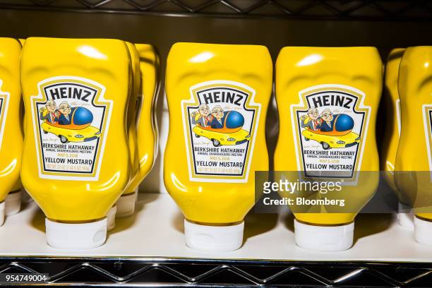 Berkshire Hathaway branded bottled of Kraft Heinz Co. Yellow Mustard are displayed during a shareholders shopping day ahead of the Berkshire Hathaway...