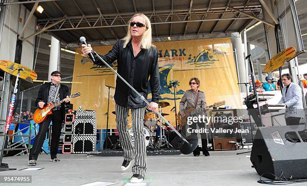 Rick Nielsen, Robin Zander and Tom Petersson of Cheap Trick performs at the tailgate stage at the Miami Dolphins game at Landshark Stadium on...