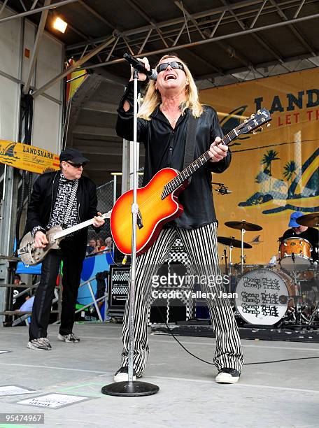 Rick Nielsen and Robin Zander of Cheap Trick performs at the tailgate stage at the Miami Dolphins game at Landshark Stadium on December 27, 2009 in...
