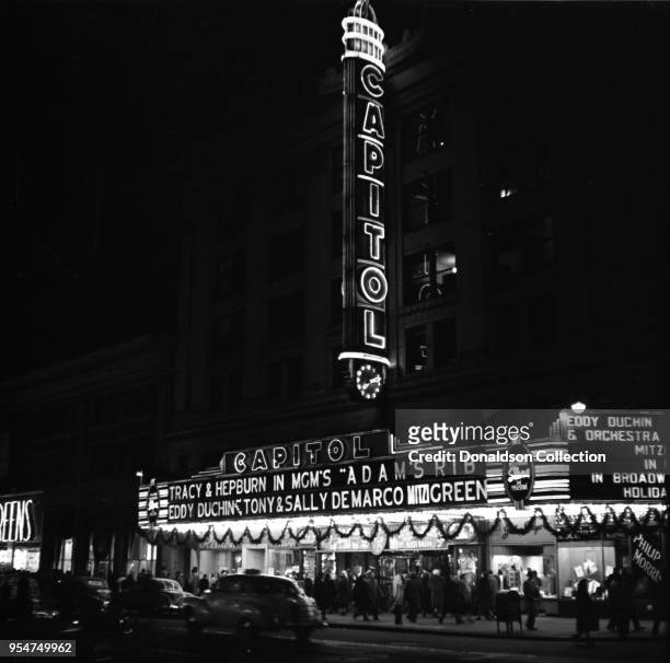 The Capitol Theater marquee on Broadway reads "Tracy and Hepburn in MGM's 'Adam's Rib' Eddy Duchin, Tony and Sal DeMarco, Mito Green" on November 18,...