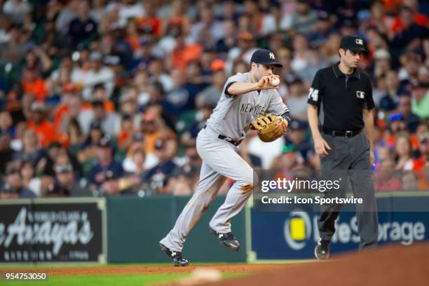 New York Yankees second baseman Neil Walker makes a play for the out Houston Astros right fielder Josh Reddick in the eighth inning during an MLB...