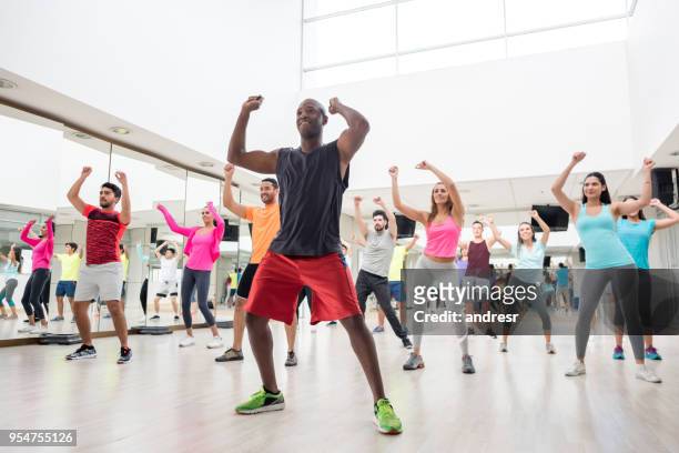 diverse group of people at a rumba lesson in the gym - rumba stock pictures, royalty-free photos & images