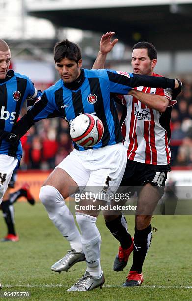 Miguel Llera of Charlton Athletic holds back Sam Wood of Brentford during the Coca Cola League One match between Brentford and Charlton Athletic at...