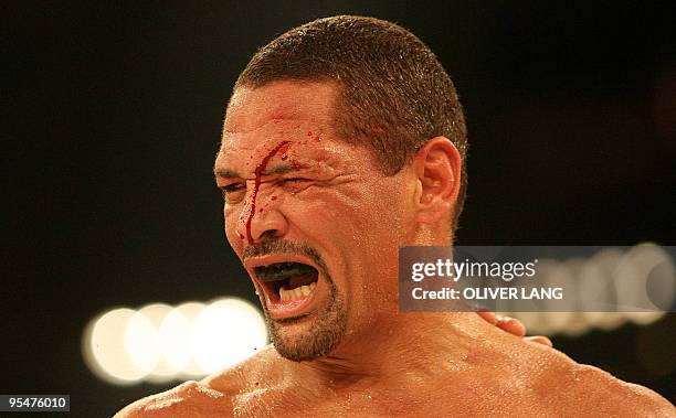 Virgil Hill of the US is seen with a blood covered face during his WBA World Cruiserweight title bout against German boxer Henry Maske 31 March 2007...