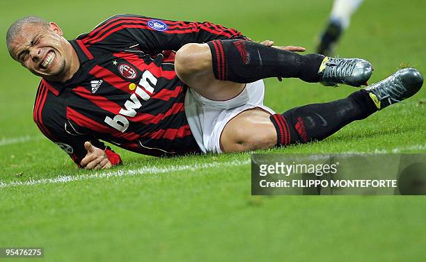 Milan's brazilian forward Ronaldo reacts after beeing kicked by a Sampdoria's player during their Italian serie A football match at Milan's San Siro...