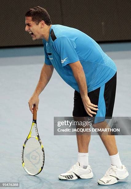 Spaniard Nicolas Almagro is injured while playing against his counterpart Rafael Nadal during their ATP Paris Indoor Master Tournament tennis match...