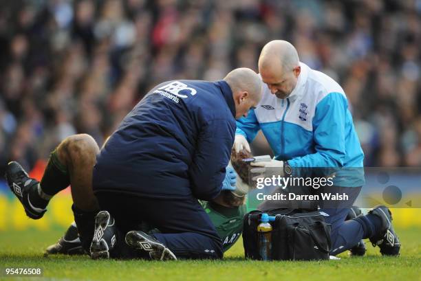 Joe Hart of Birmingham City has his head strapped during the Barclays Premier League match between Birmingham City and Chelsea at St. Andrew's...