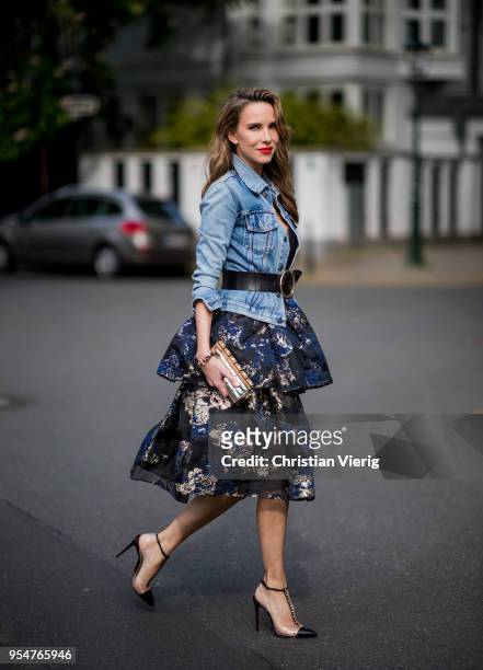 Alexandra Lapp wearing tiered corded lace and brocade in a mix of black, midnight-blue and gold by Marchesa Notte, blue trucker denim jacket by...
